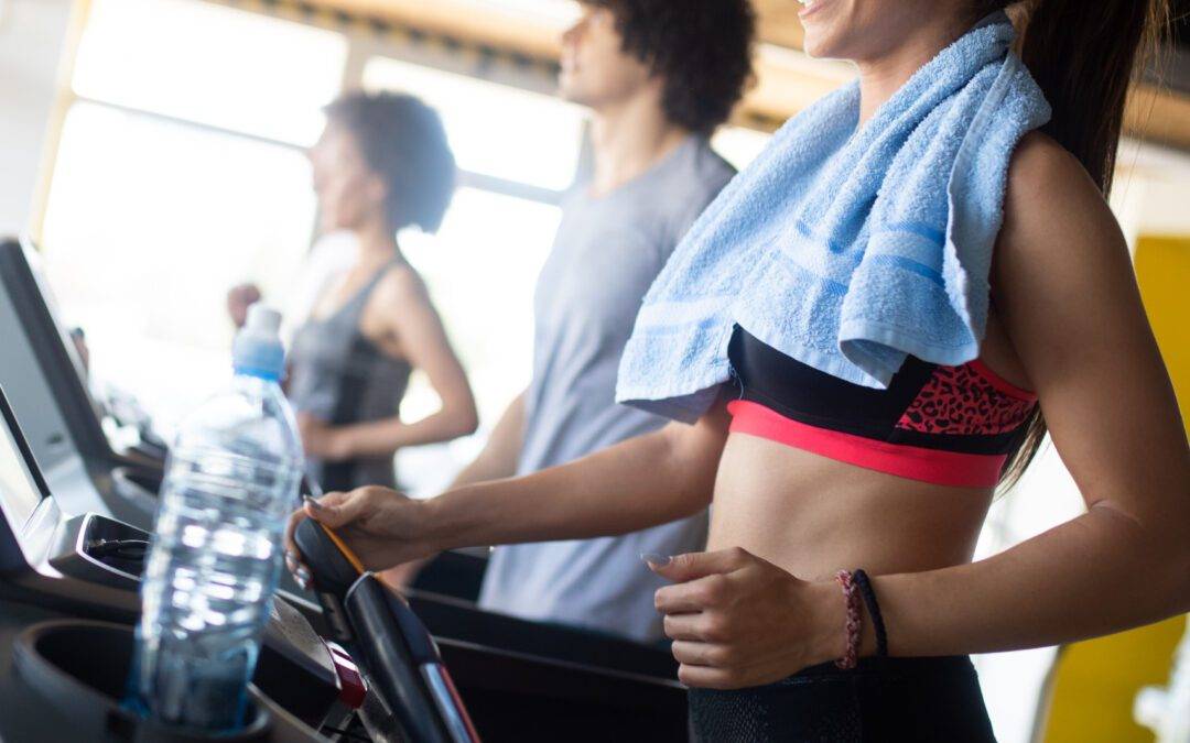 Group of sportive people in a gym. Concepts about lifestyle and sport in a fitness club