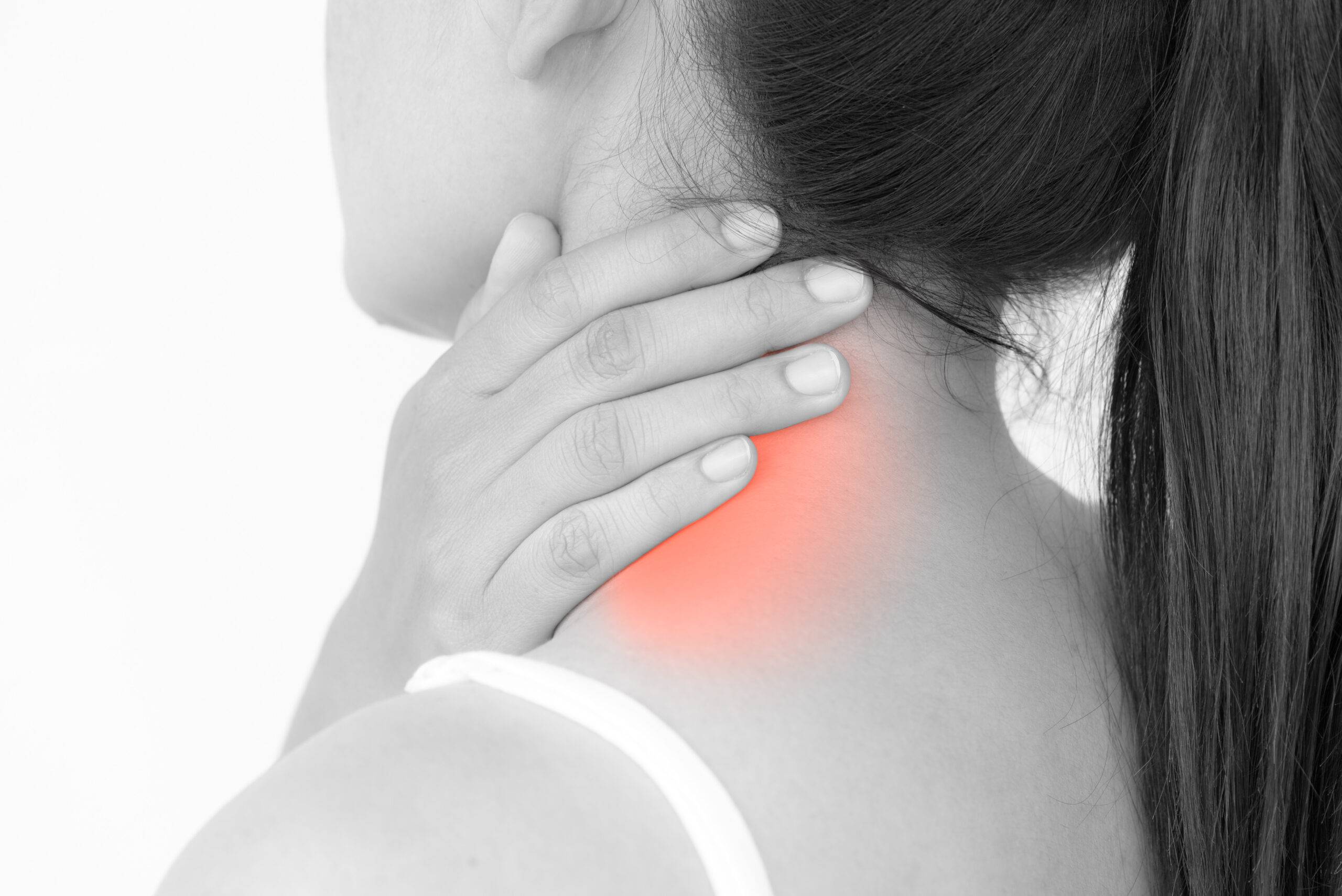 Closeup woman neck and shoulder pain and injury. Health care and medical concept.