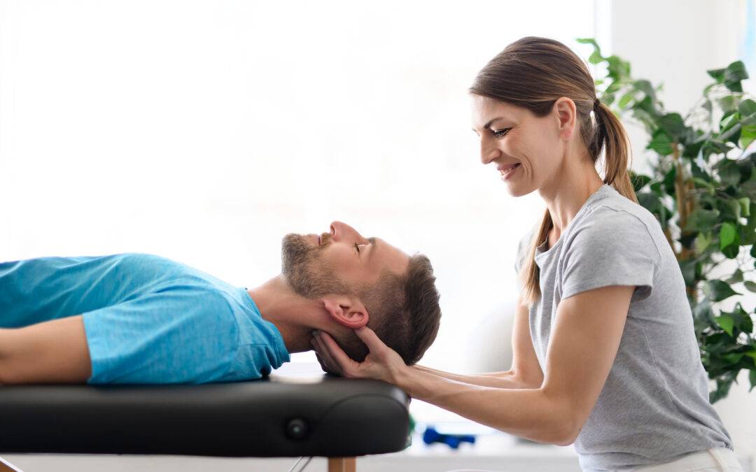 A Modern rehabilitation physiotherapy woman worker with man client neck treatment